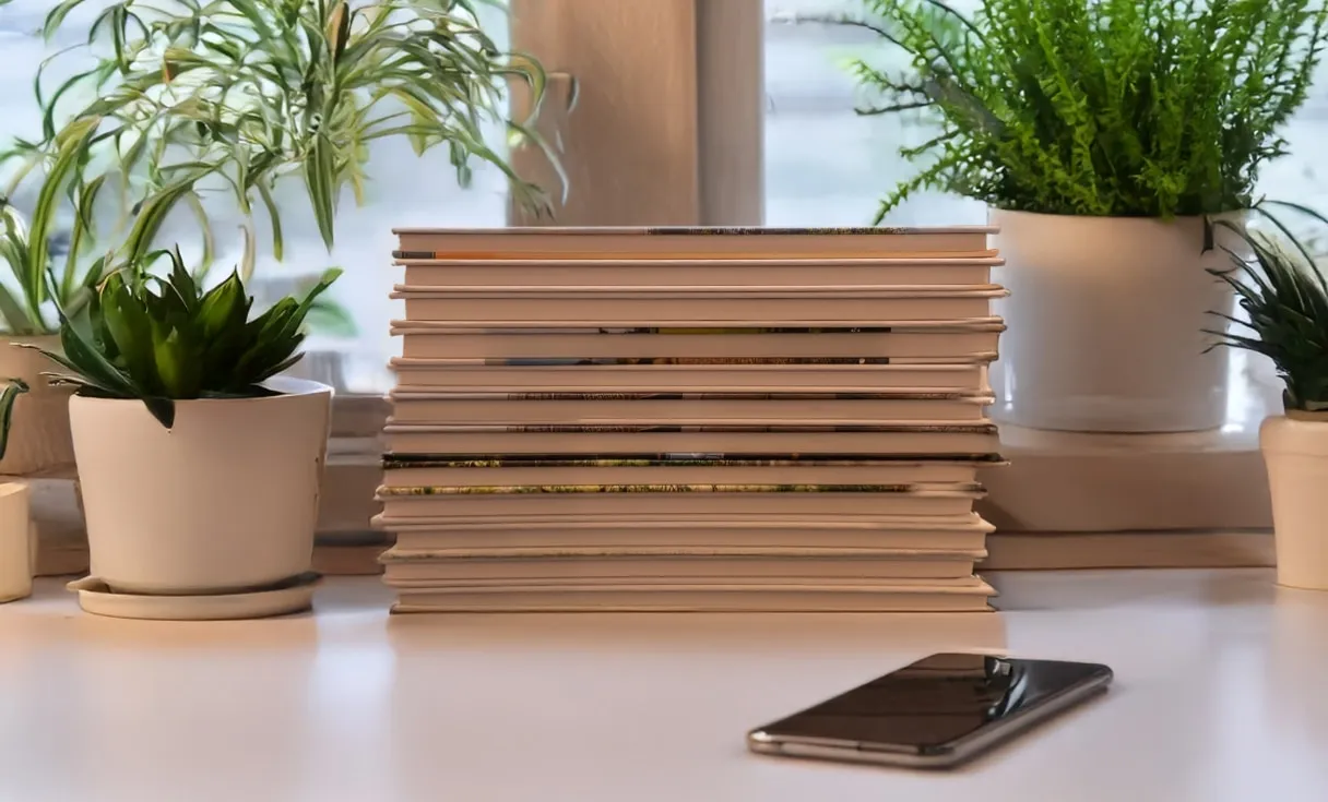 Stack of custom printed photo books in different sizes and cover designs