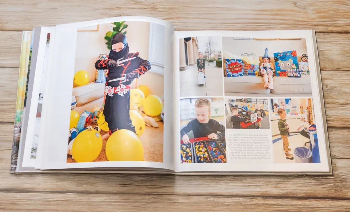 Open photo book displaying printed pages with vivid photos and custom layouts