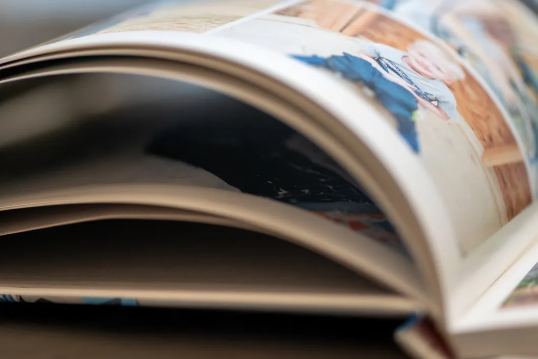 Close-up of printed photo book pages showing sharp detail and rich color reproduction